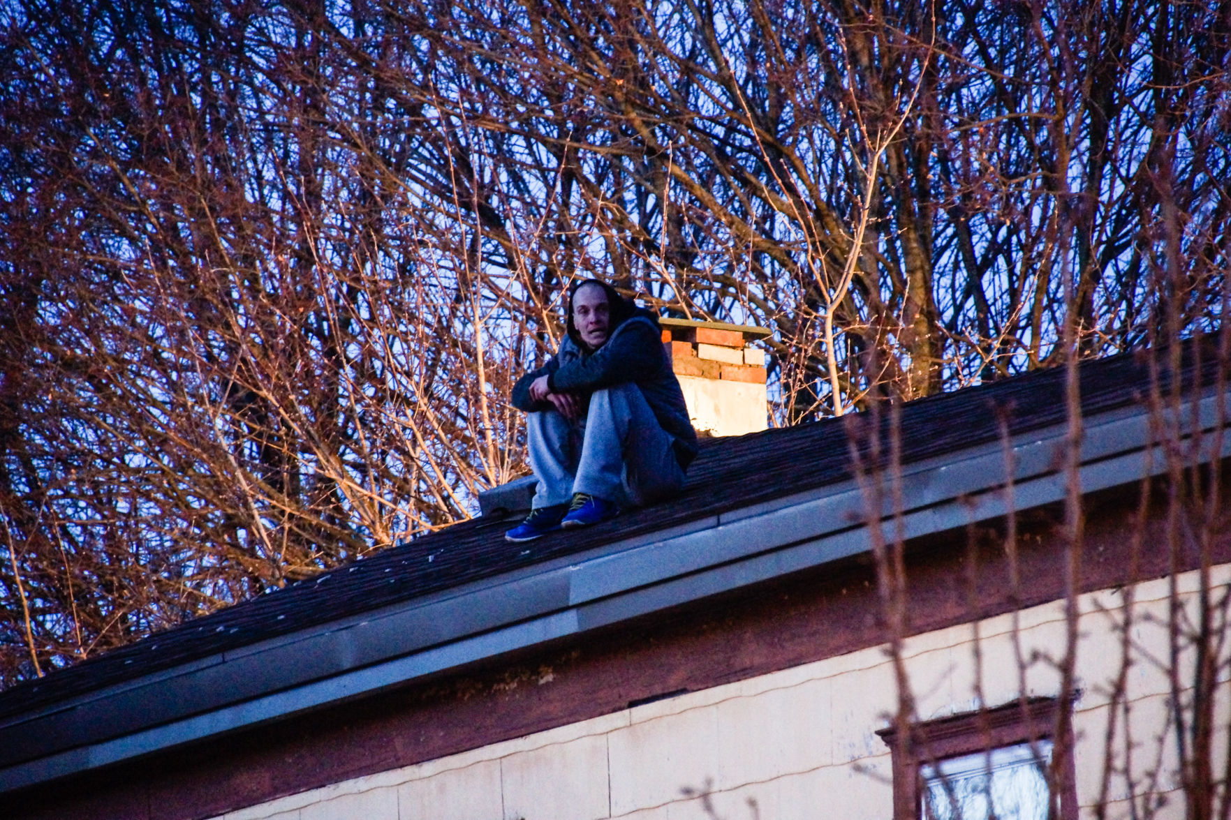 Man on Roof of 51 Orchard St.